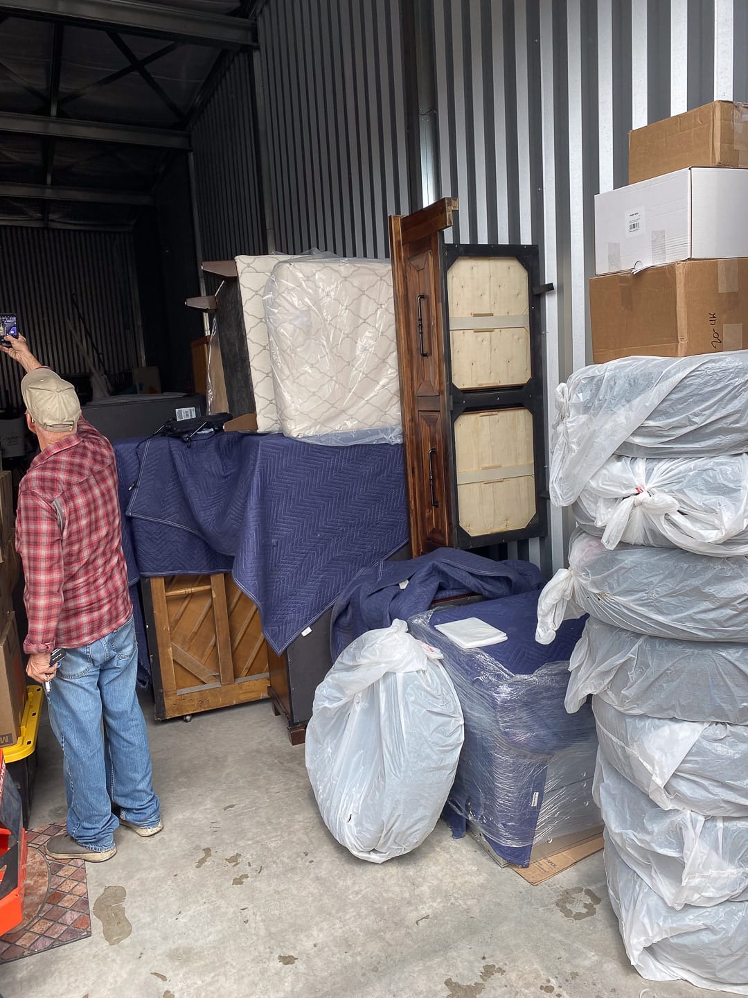 Blanket-wrapped furniture staged and ready to load