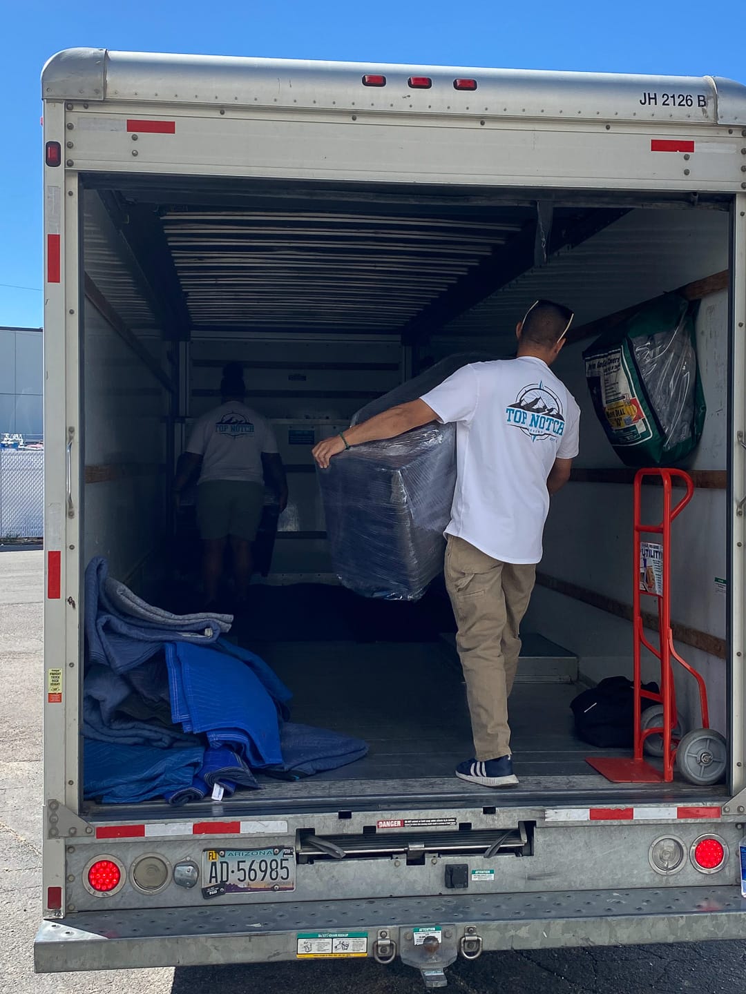 Top Notch mover loading the truck box by box on moving day