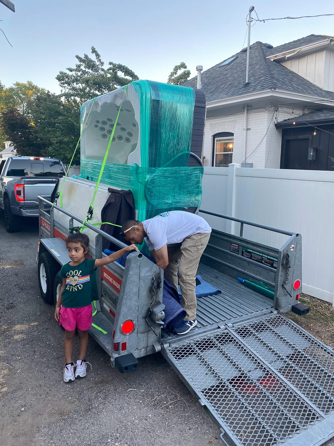 Commercial equipment eased down the trailer ramp