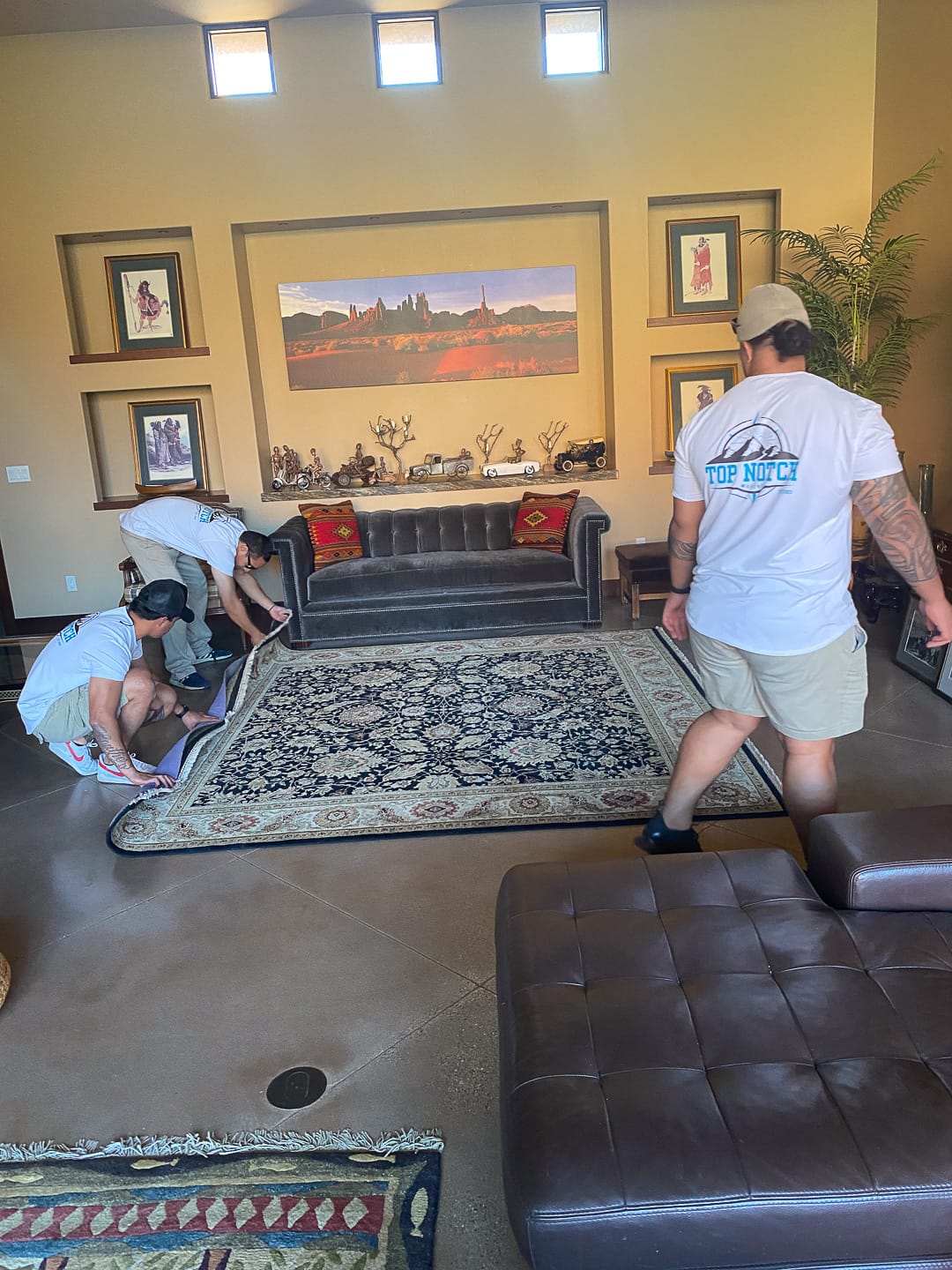 Rolling out the rug in the new living room