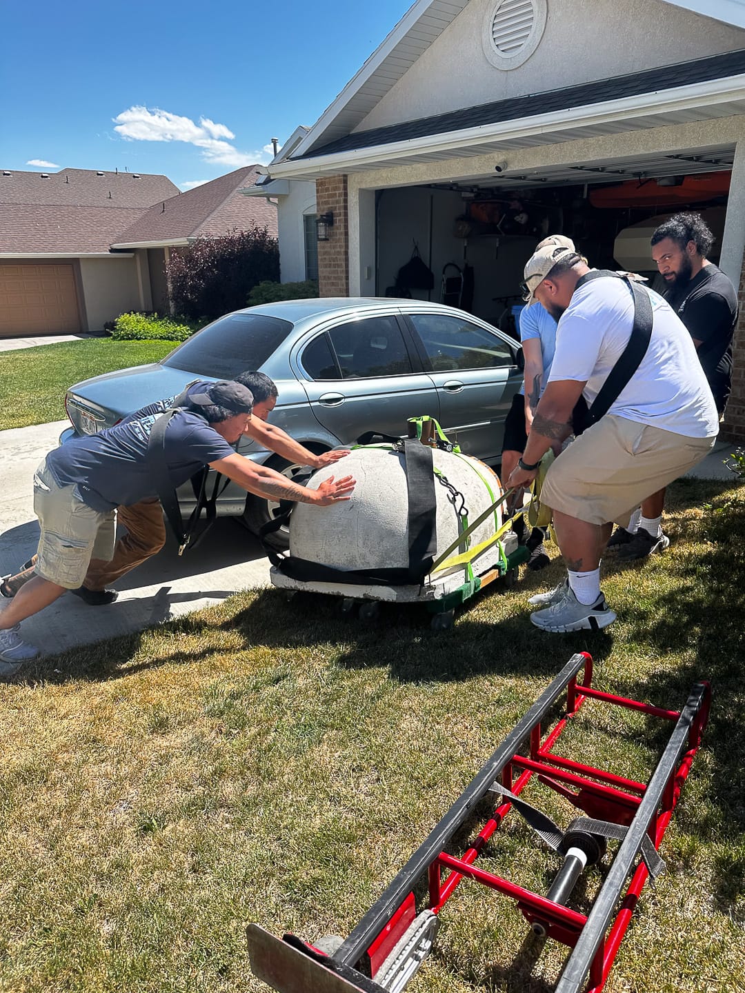 Heavy specialty dolly work across the lawn